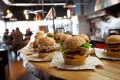 Why burger restaurants are popular in town?