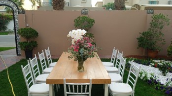 Decorated tables and clean chairs for rent in Dubai.